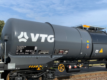 Gray tank car under a blue sky